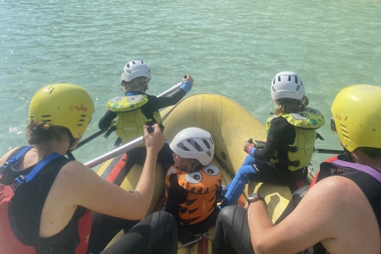 young kids rafting on soca river